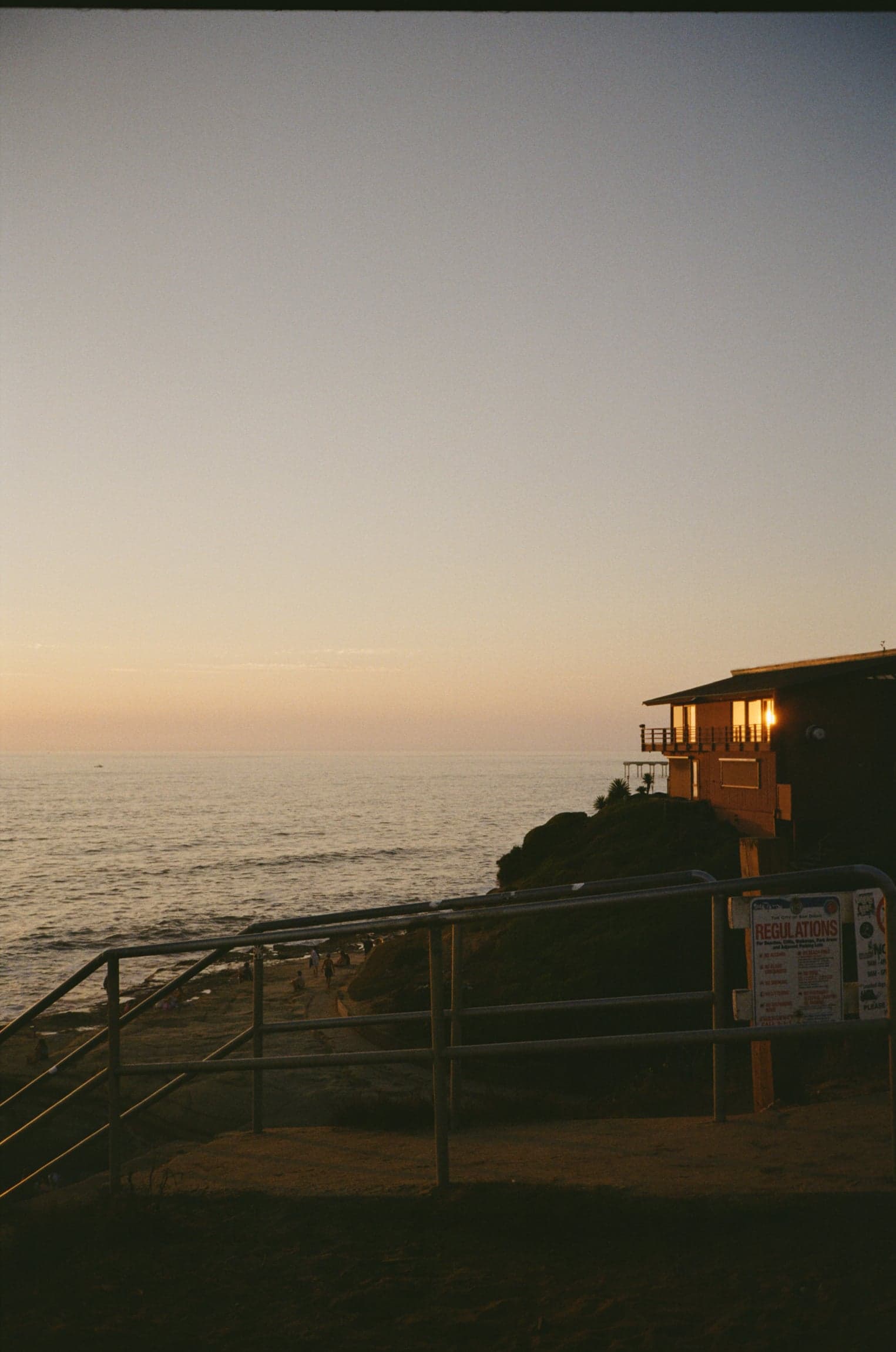 Sunset over the ocean from a clifftop